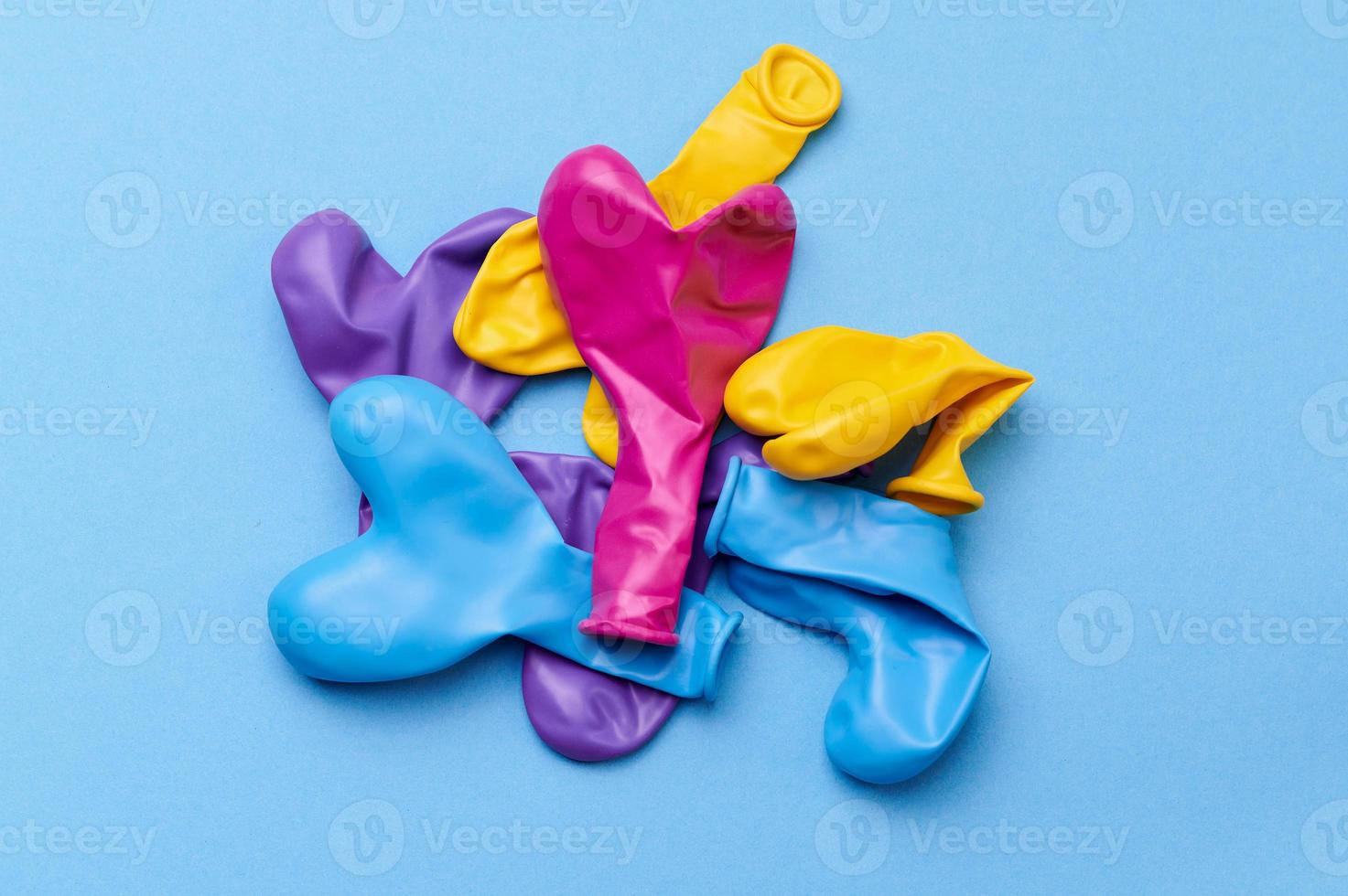 colored heart shaped balloons on blue background photo