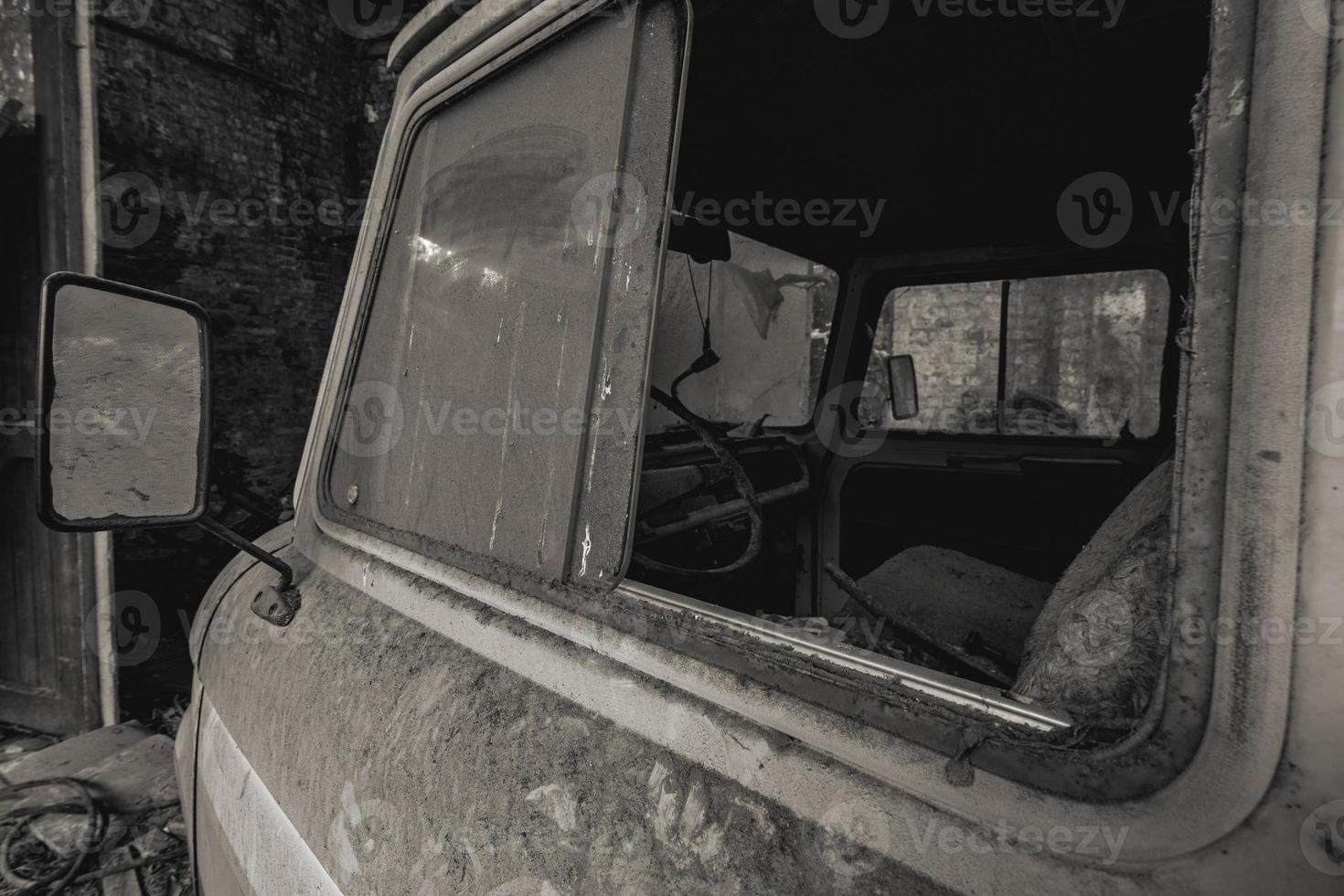 Urbex, abandoned old garage with a old car photo