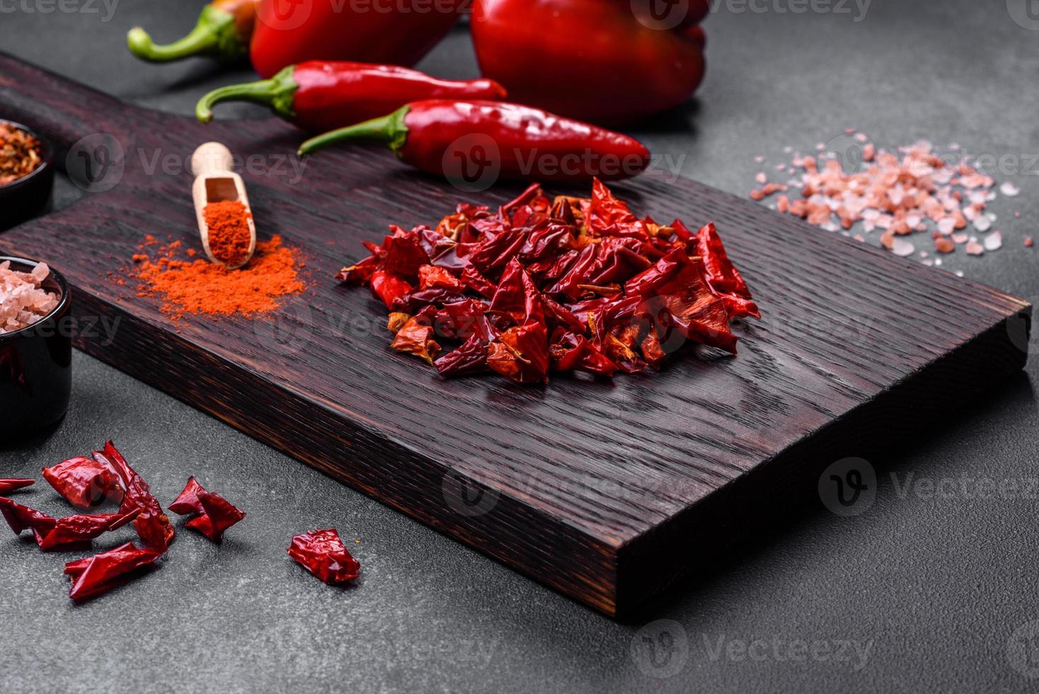 Pieces of dried paprika, preparation of powder spice for various dishes photo