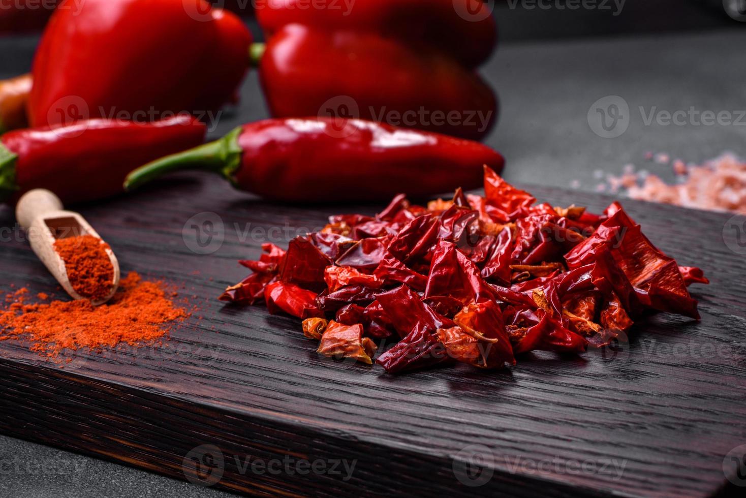 Pieces of dried paprika, preparation of powder spice for various dishes photo