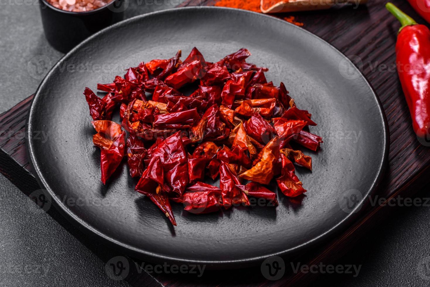 Pieces of dried paprika, preparation of powder spice for various dishes photo