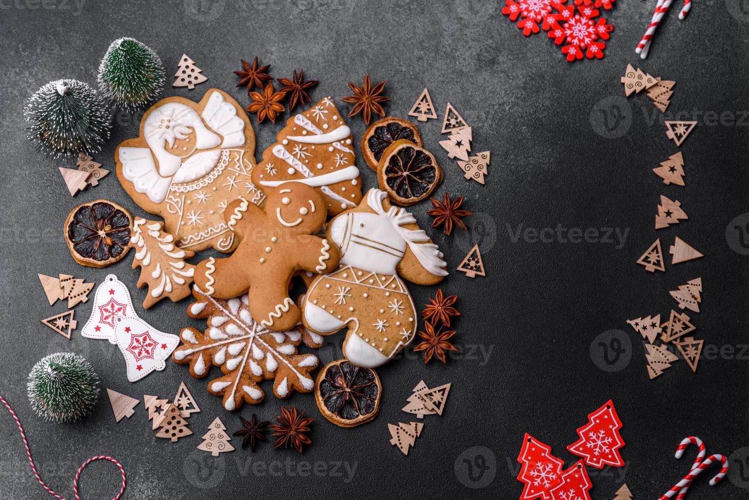 Delicious gingerbread cookies with honey, ginger and cinnamon. Winter composition photo