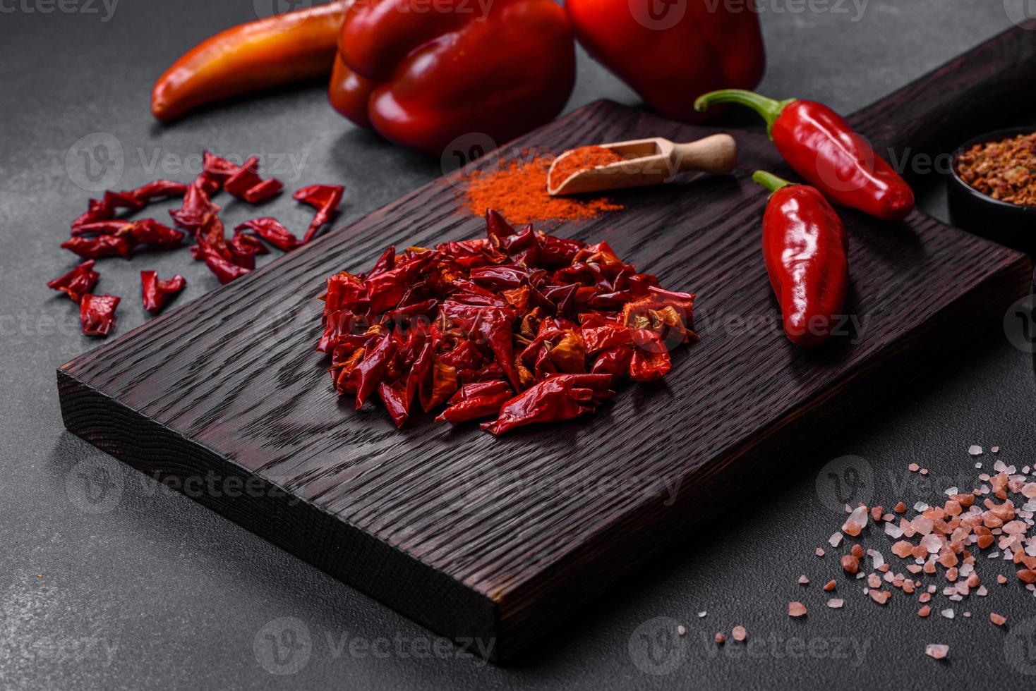 Pieces of dried paprika, preparation of powder spice for various dishes photo