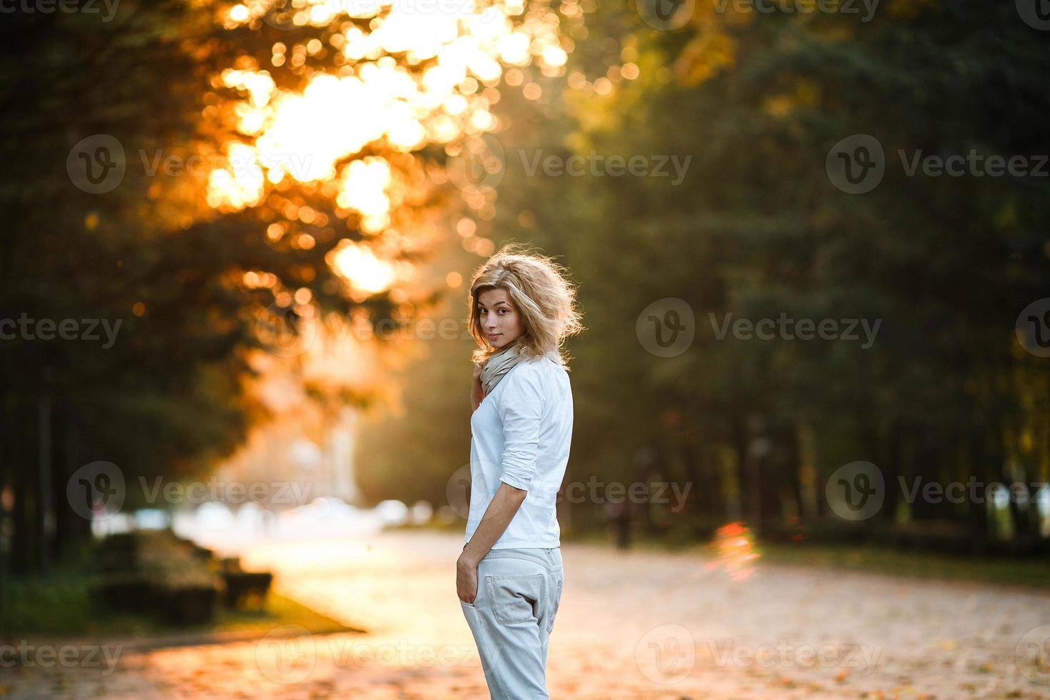 beautiful girl in sunset light photo