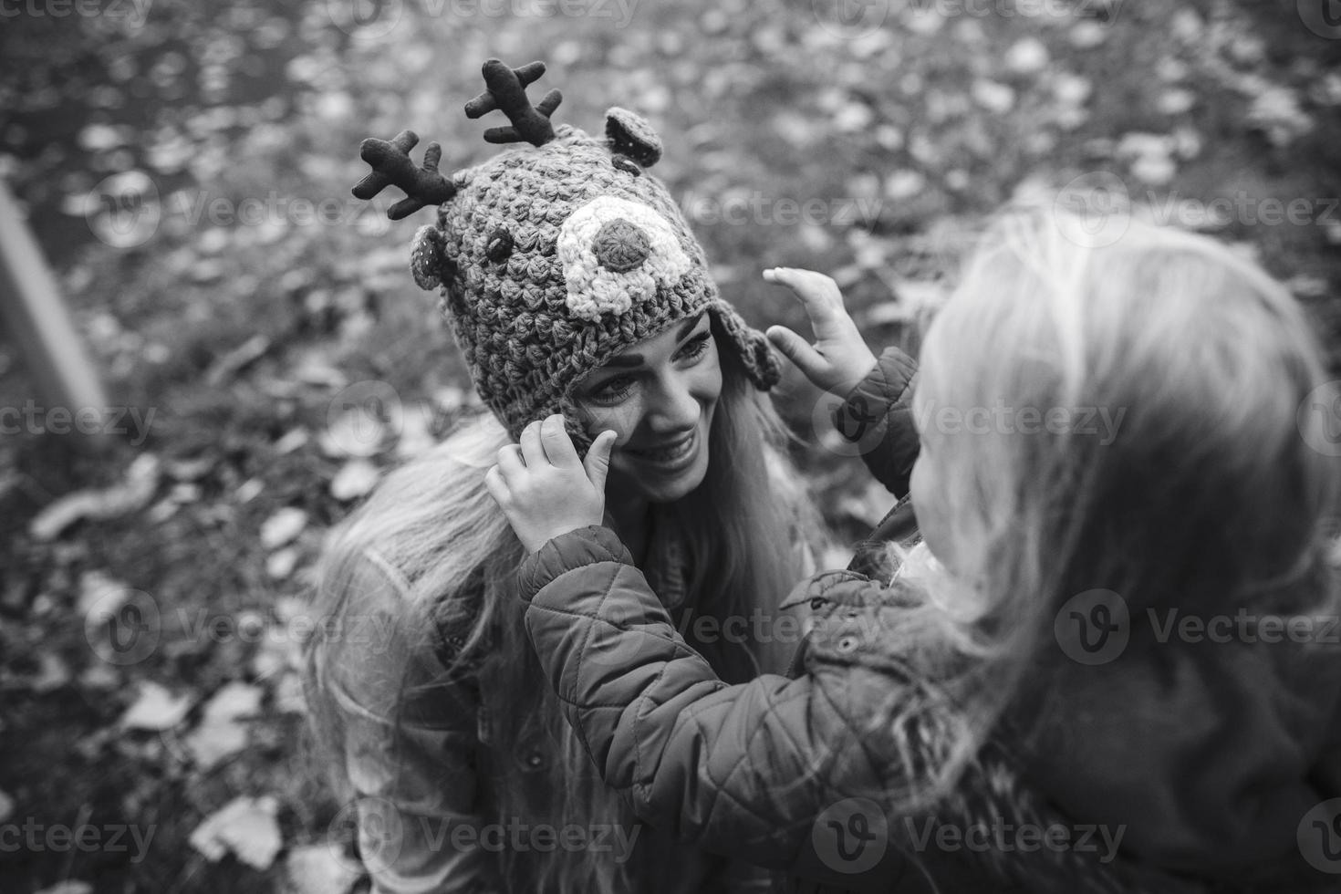 Mother with daughter in autumn park photo