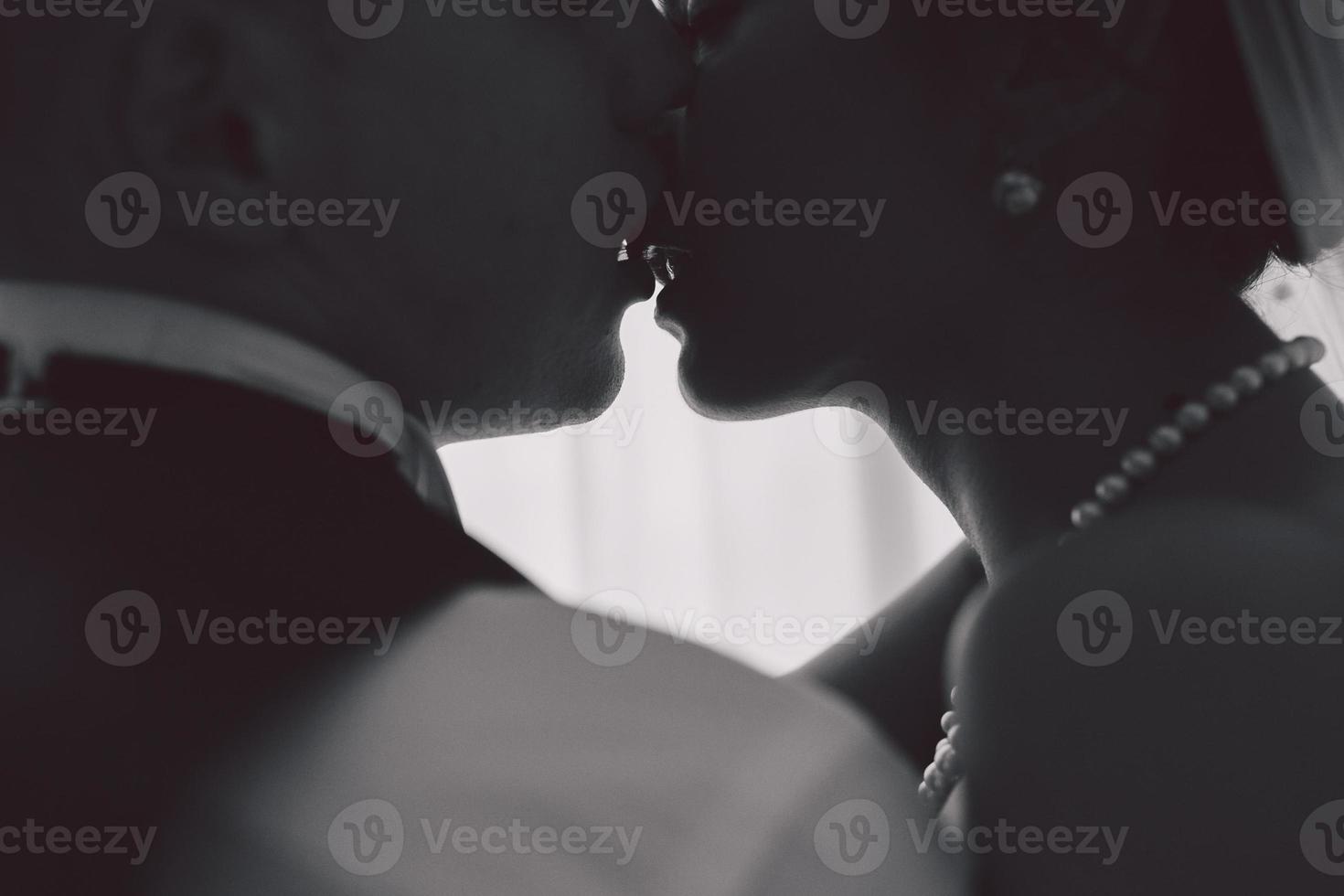 Bride and groom in a hotel room photo