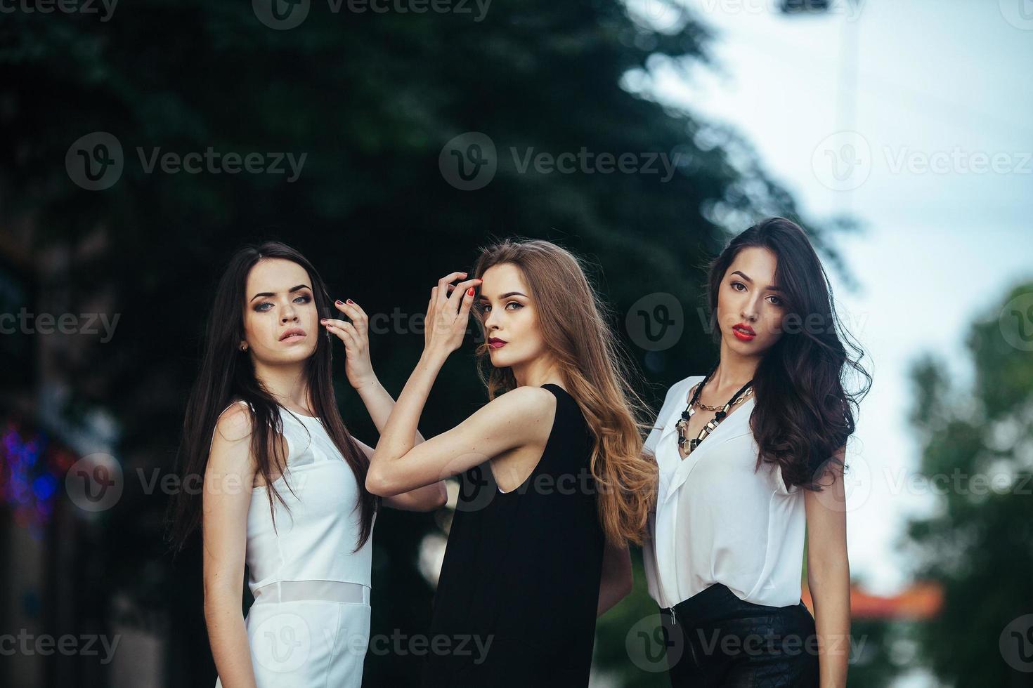 pretty girls posing in a city street photo