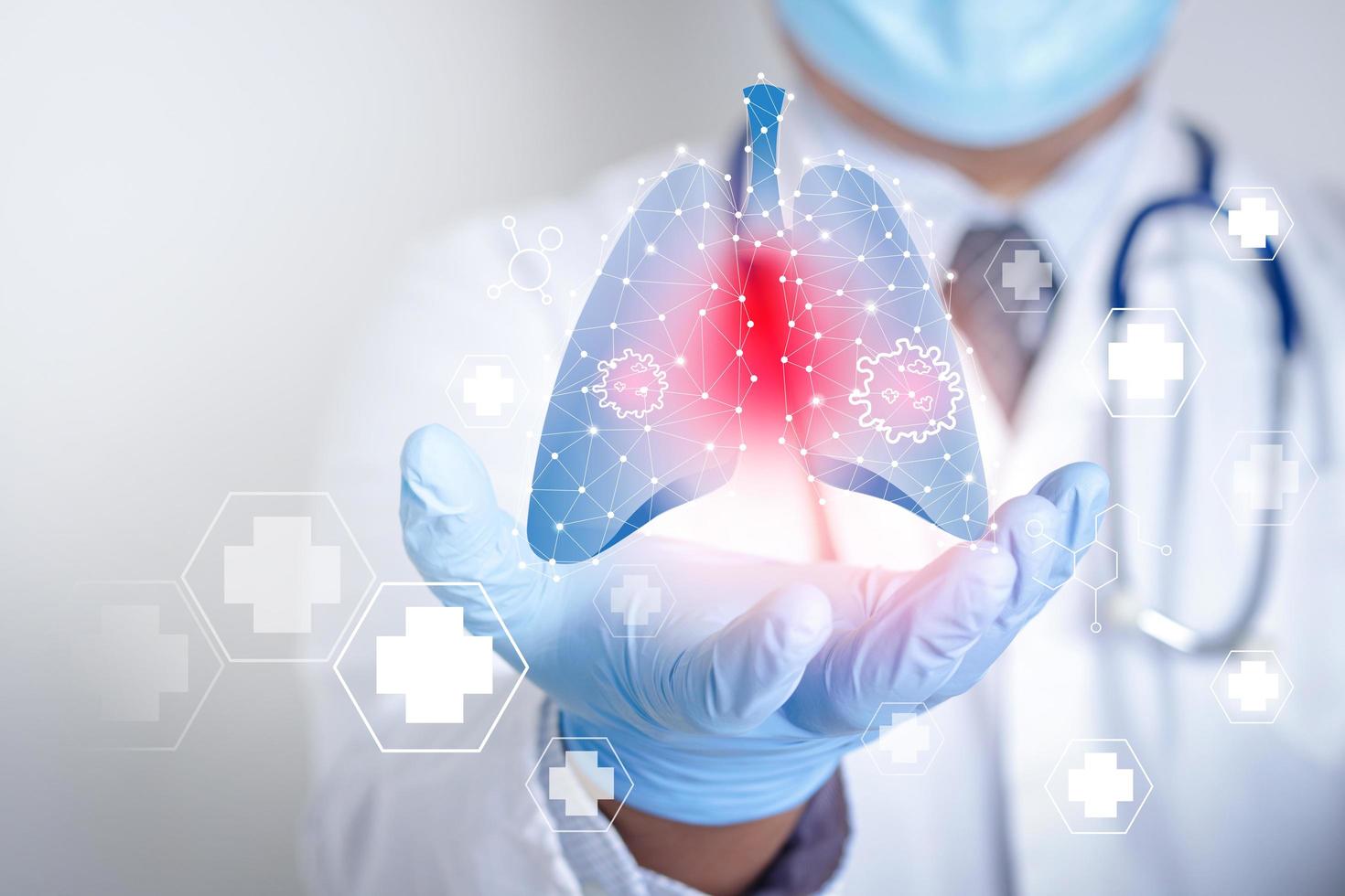 Doctors wearing masks and gloves Shows a graphical computer interface connected to a medical network. Treatment of lung disease caused by the coronavirus. Concept of health care and medical technology photo