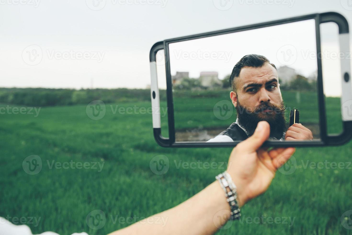 bearded man preparing to shave photo