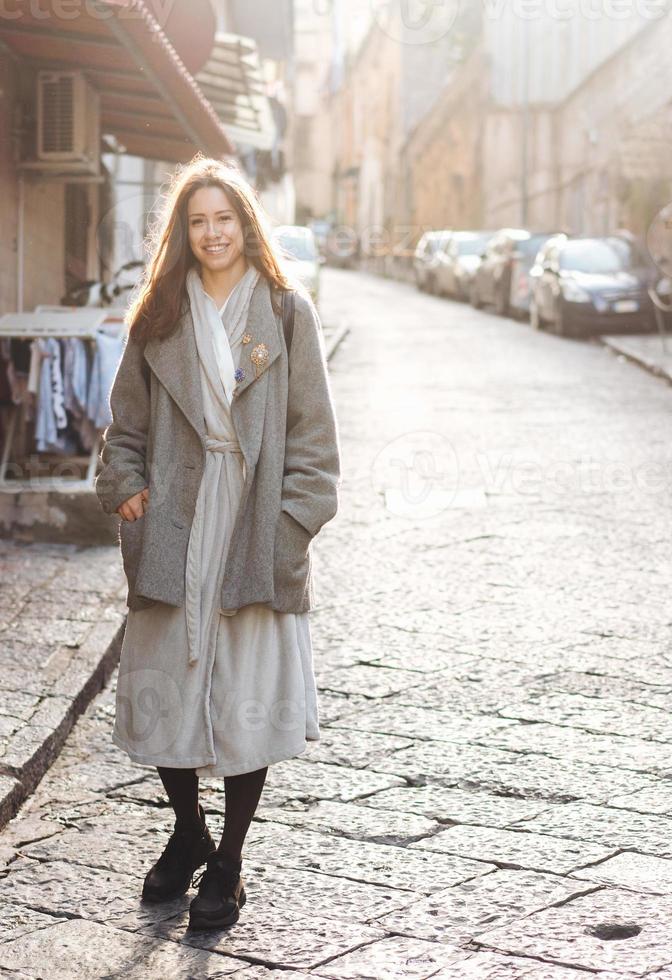 Woman walking in the old town. photo
