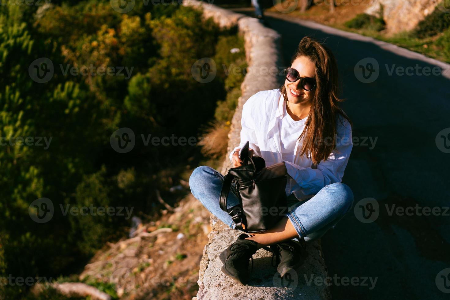 beautiful young woman resting on the nature photo