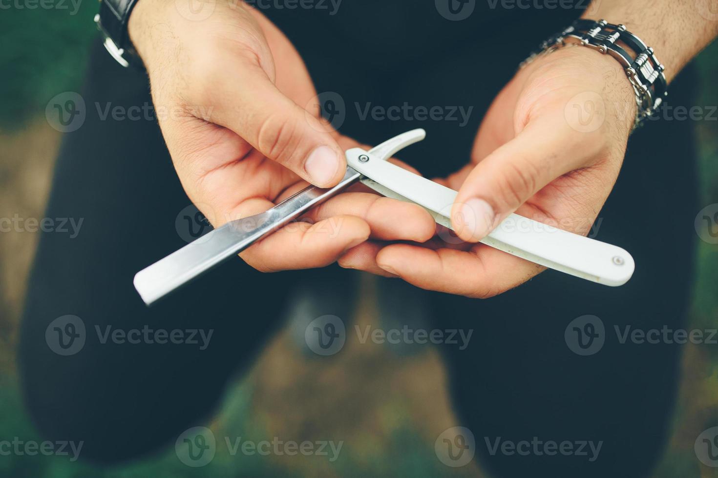 ancient blade in the hands of men photo