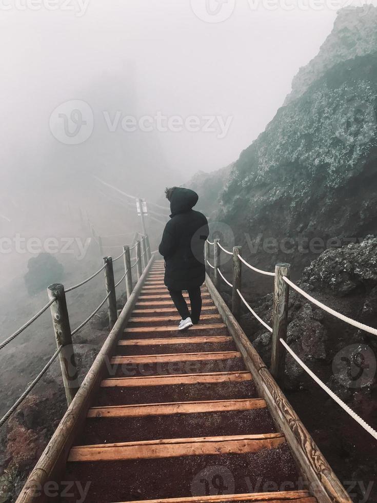 Man on the stairs railing. photo