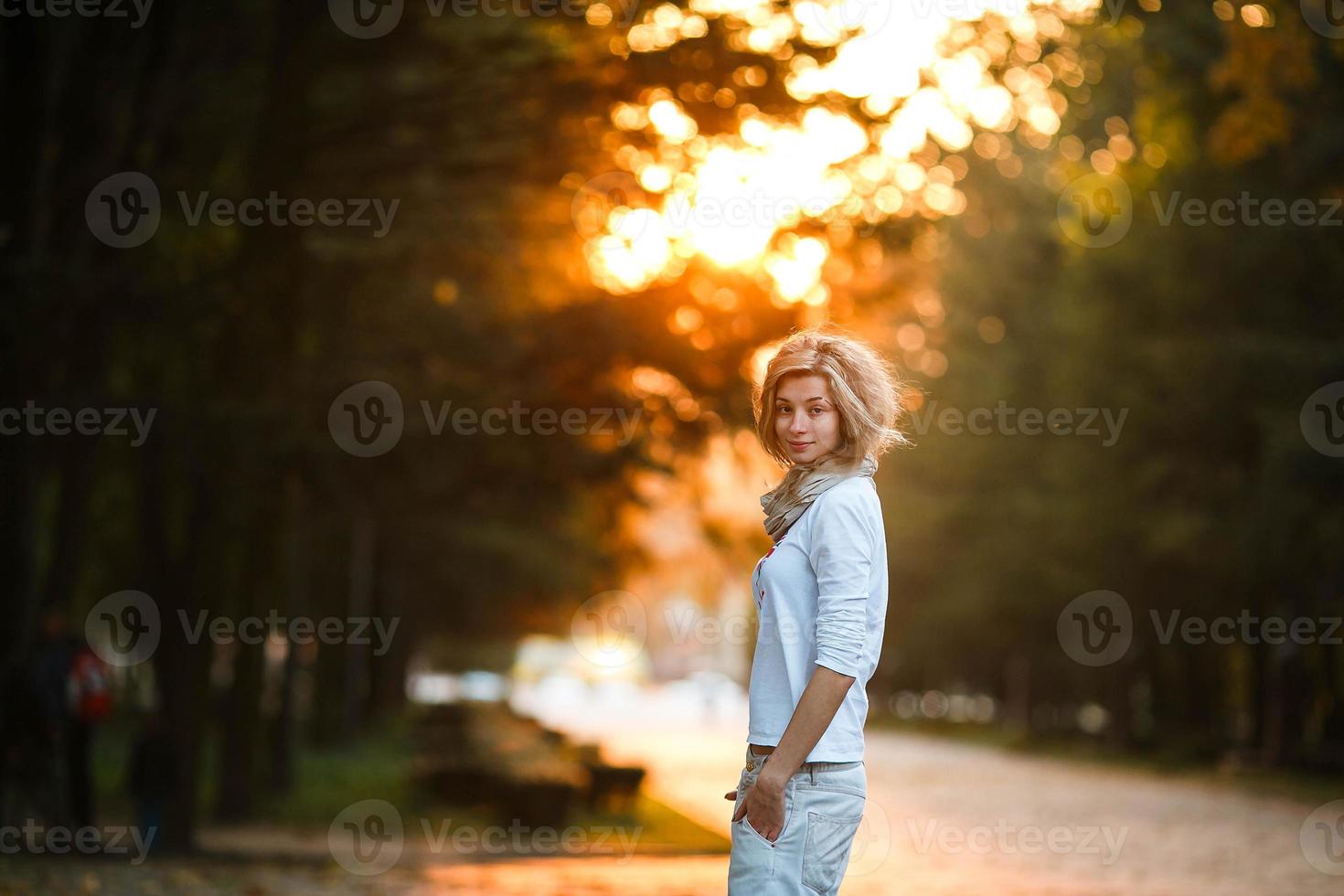 beautiful girl in sunset light photo