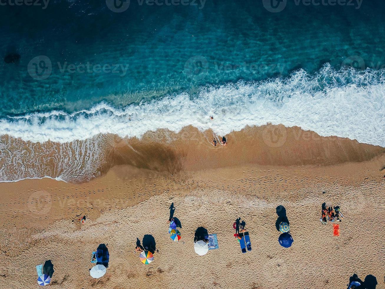 Beach with sun loungers on the coast of the ocean photo