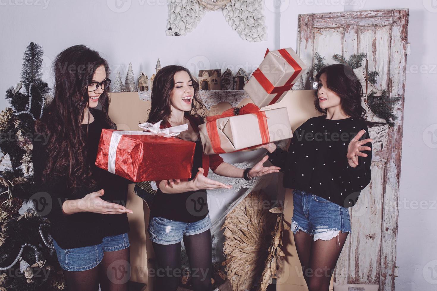 Beautiful girl throw up Christmas gifts. Decorative vintage apartment. cookies photo