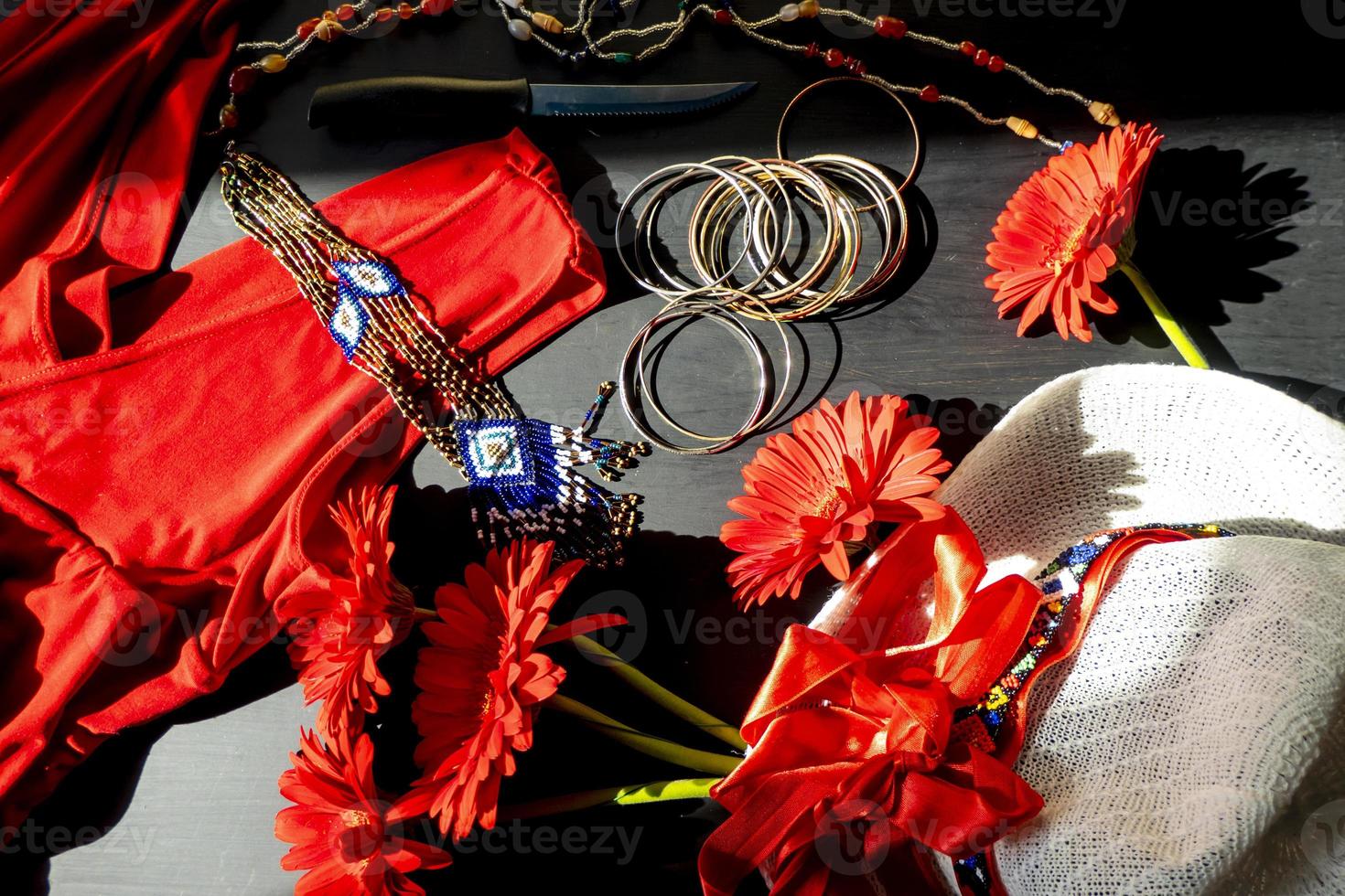 set of red, white and colorful fashion accessories on a black background photo