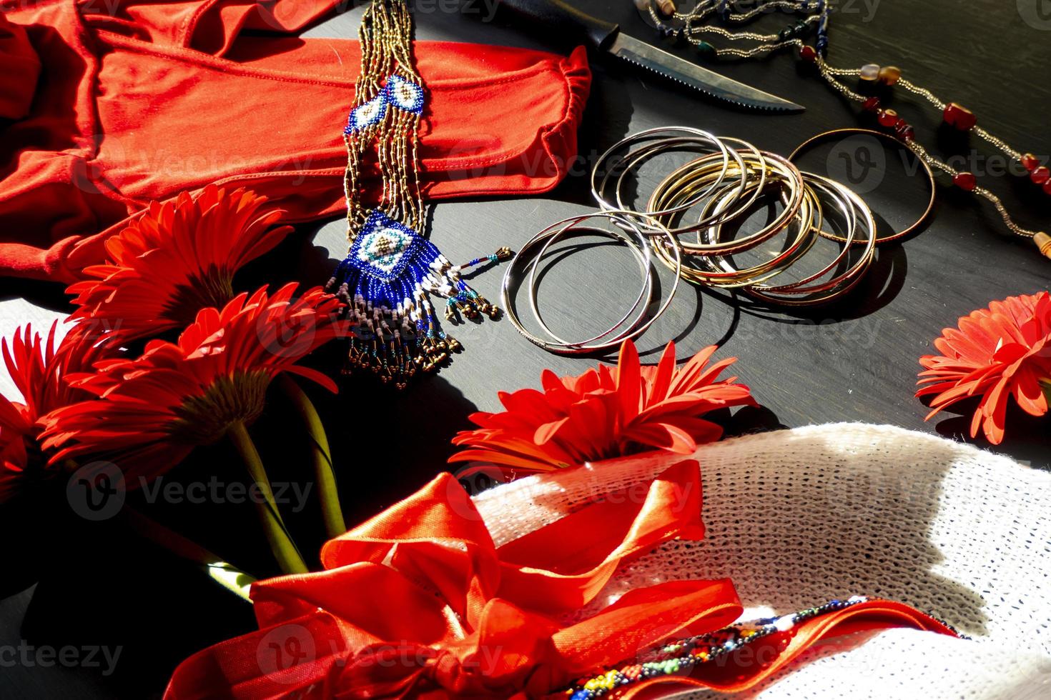 set of red, white and colorful fashion accessories on a black background photo