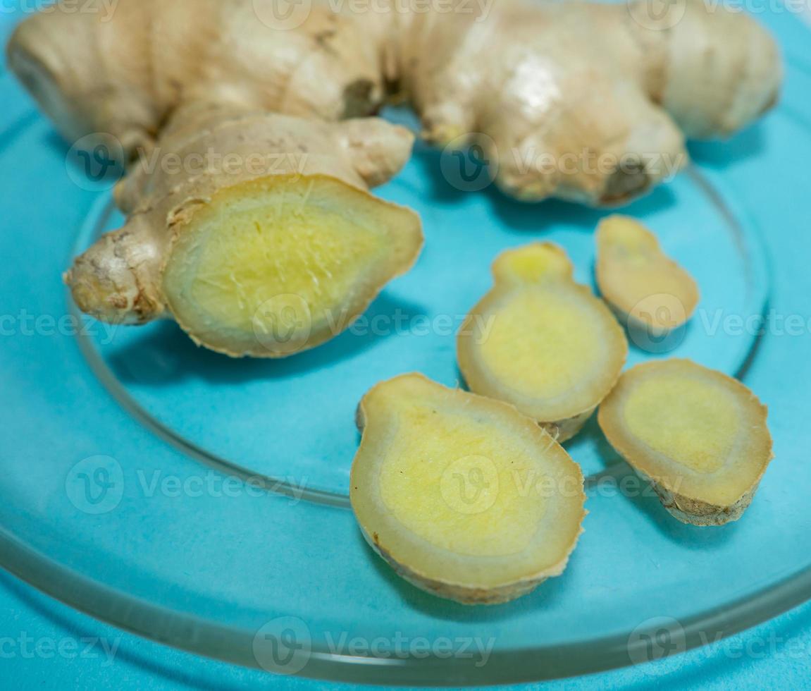 Cut ginger root on a transparent plate. 11361351 Stock Photo at Vecteezy