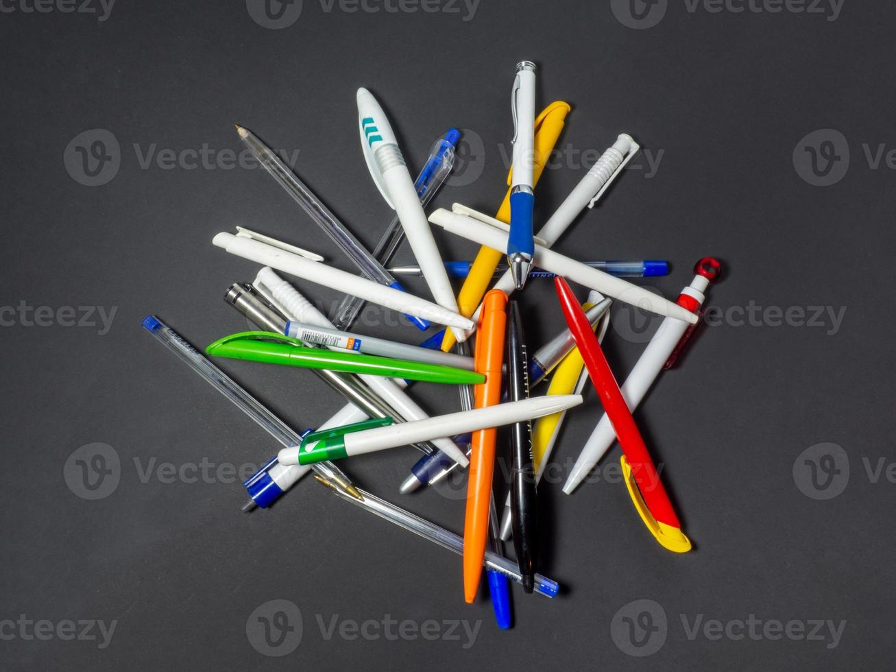 many ballpoint pens on the table photo