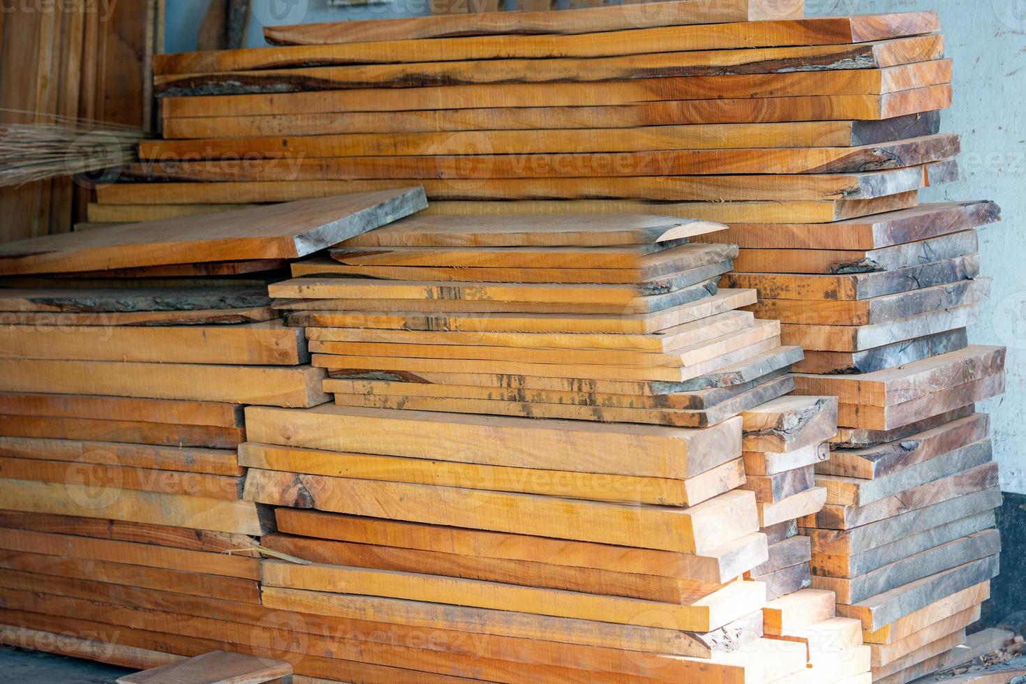 Eucalyptus Wood Plank With Blur Background. Wood Planks Are Stored For Making Wooden Furniture. Selective Focus, Copy Space. photo