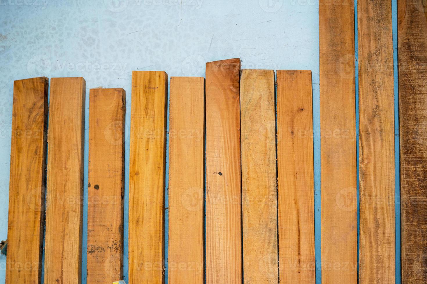 Eucalyptus Wood Plank With Blur Background. Wood Planks Are Stored For Making Wooden Furniture. Selective Focus, Copy Space. photo