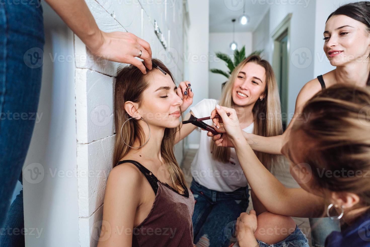 Young beauty girls doing make up photo