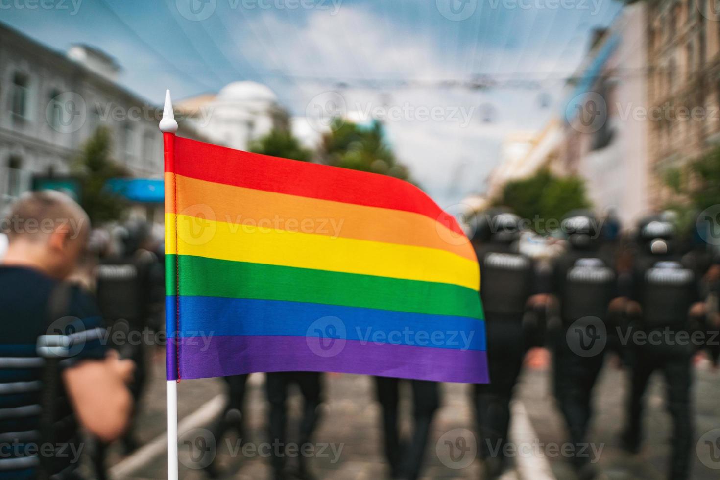 Hand hold a gay lgbt flag at LGBT gay pride parade festival photo