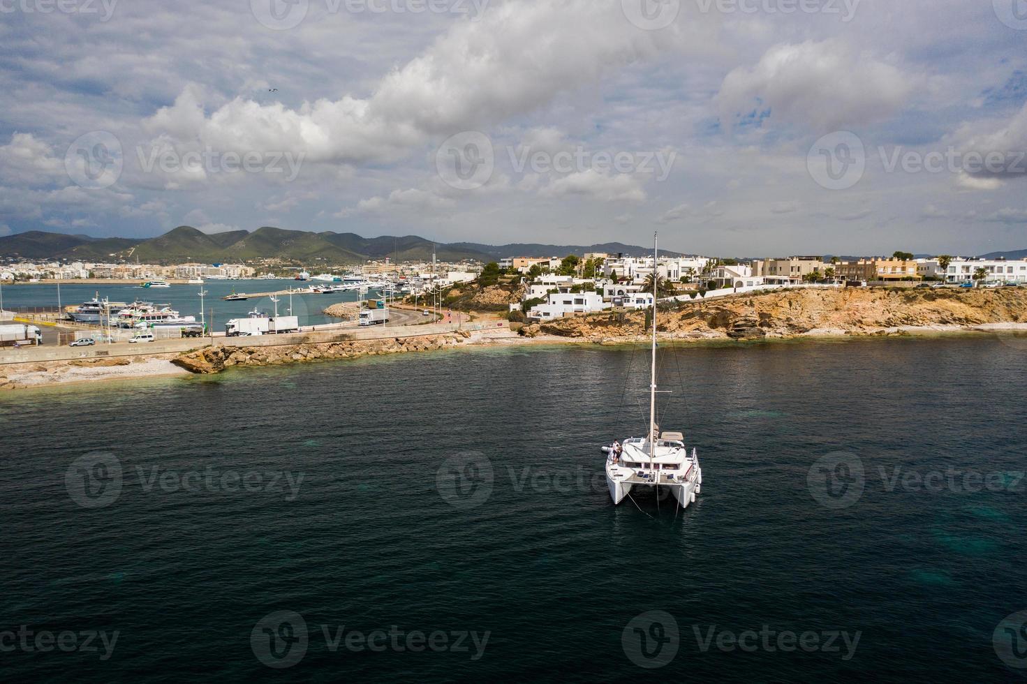 Aerial view on catamaran and port on the background. photo