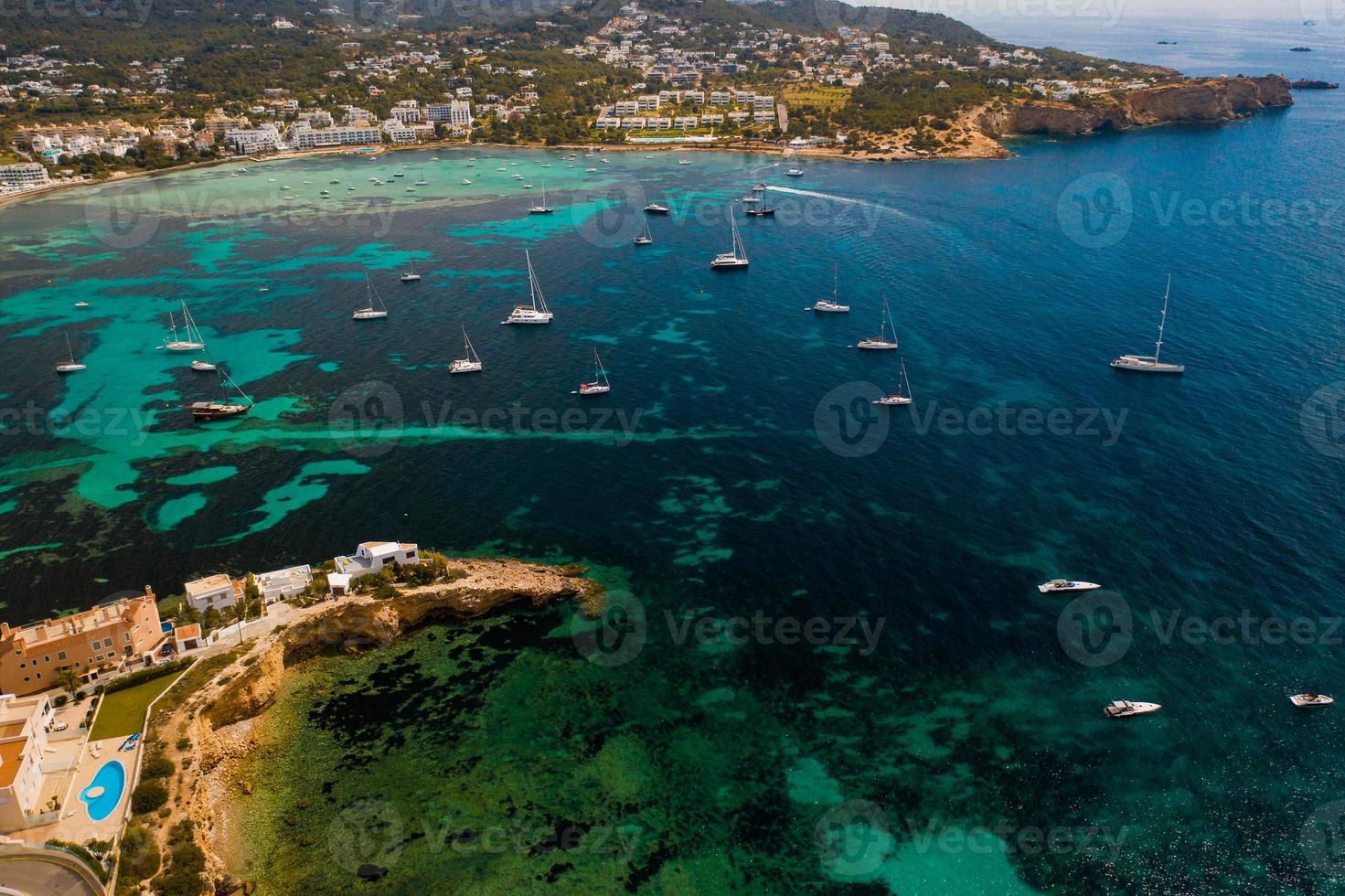 Aerial view of city and bay with yachts. photo