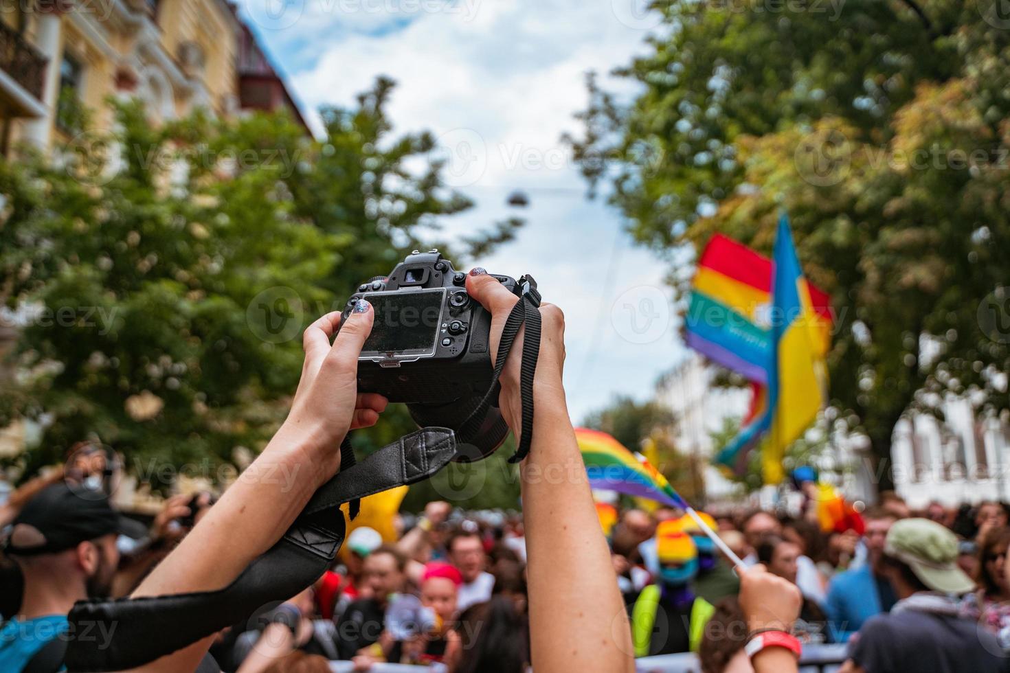 Correspondent takes photo during the Gay Pride parade