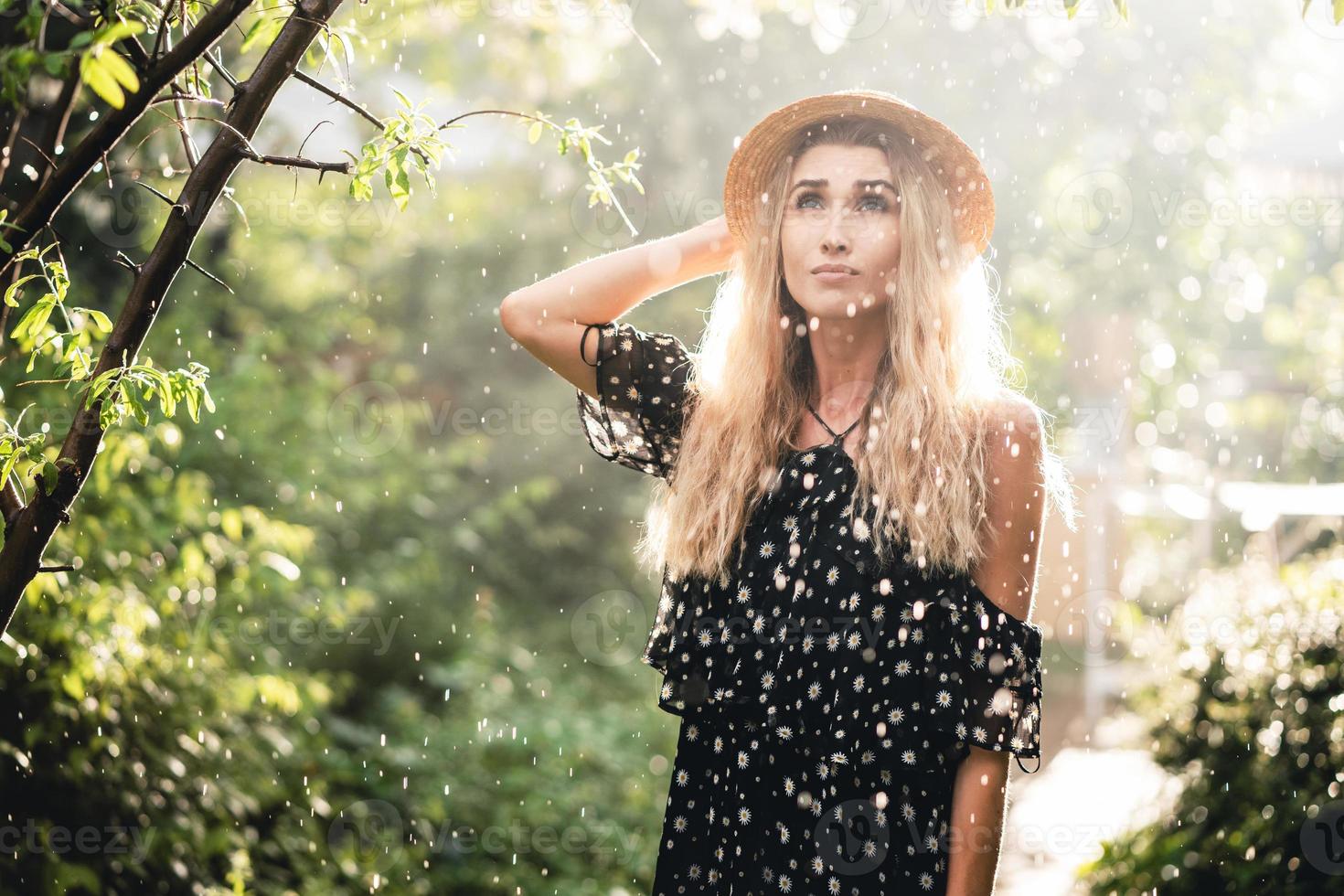 Girl in hat posing on camera photo