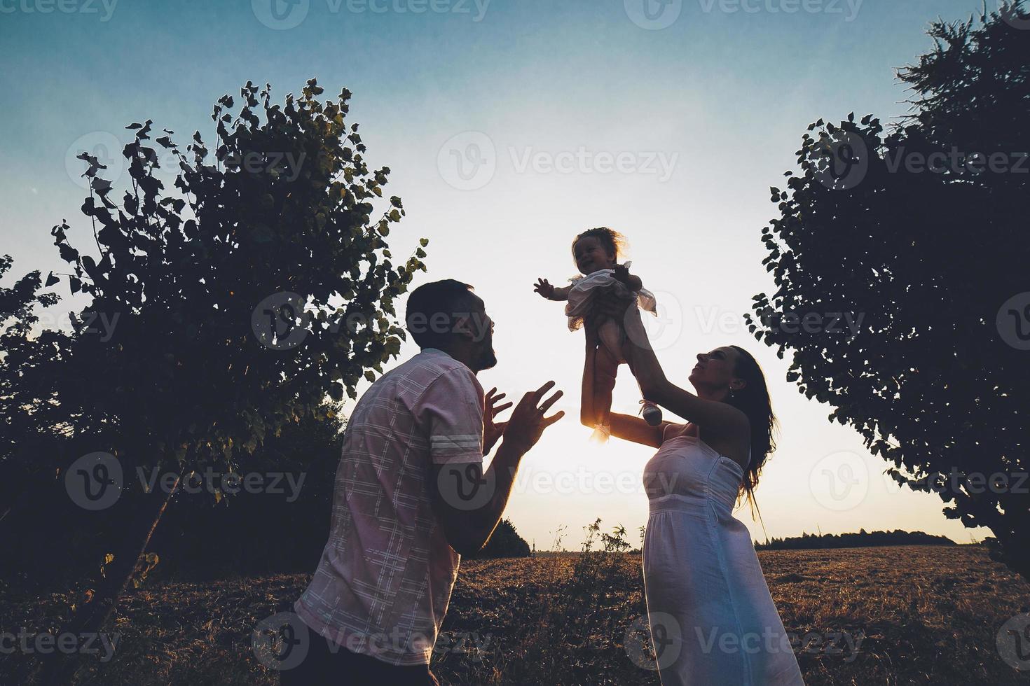 Parents and kid spending time photo