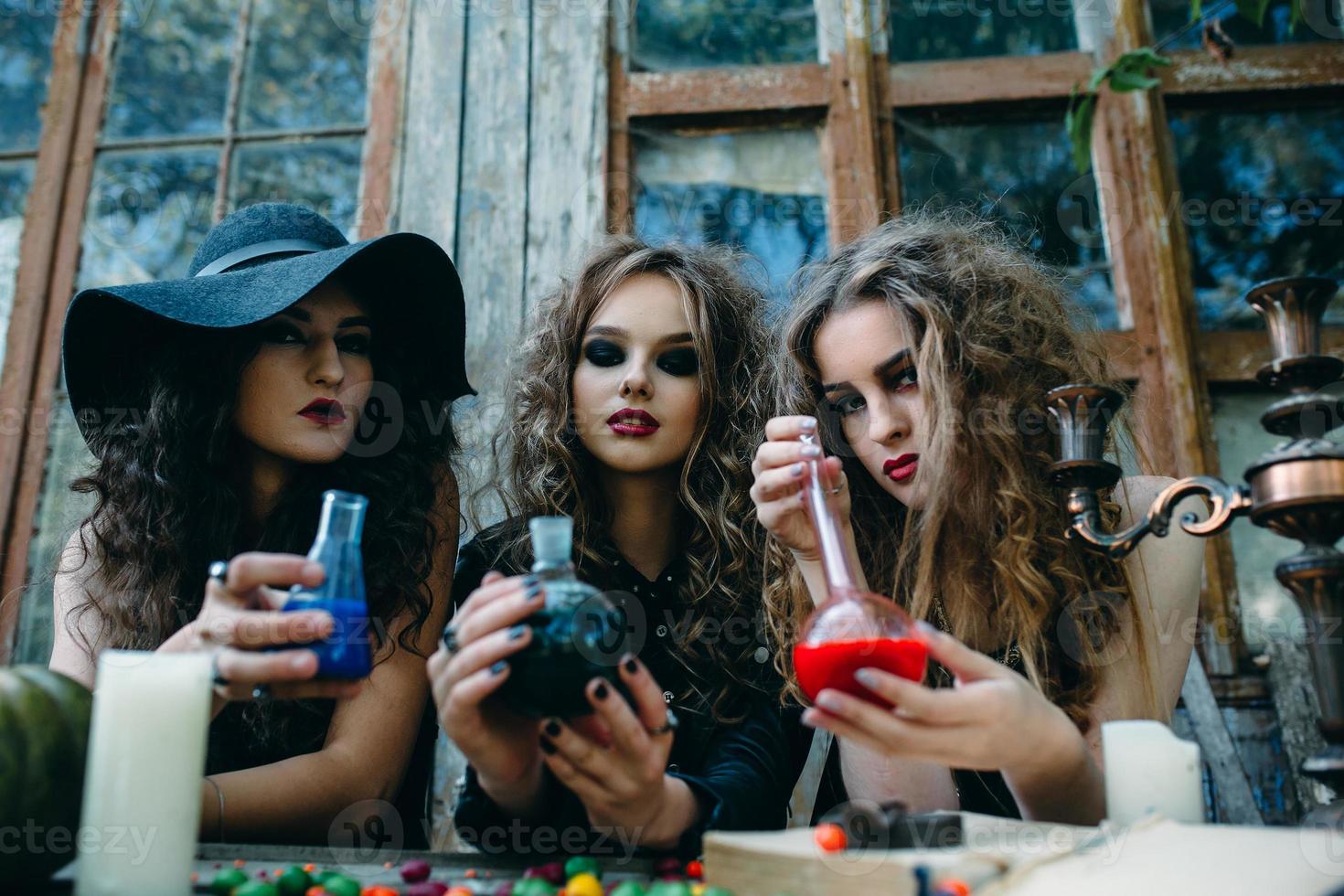 three witches at the table photo