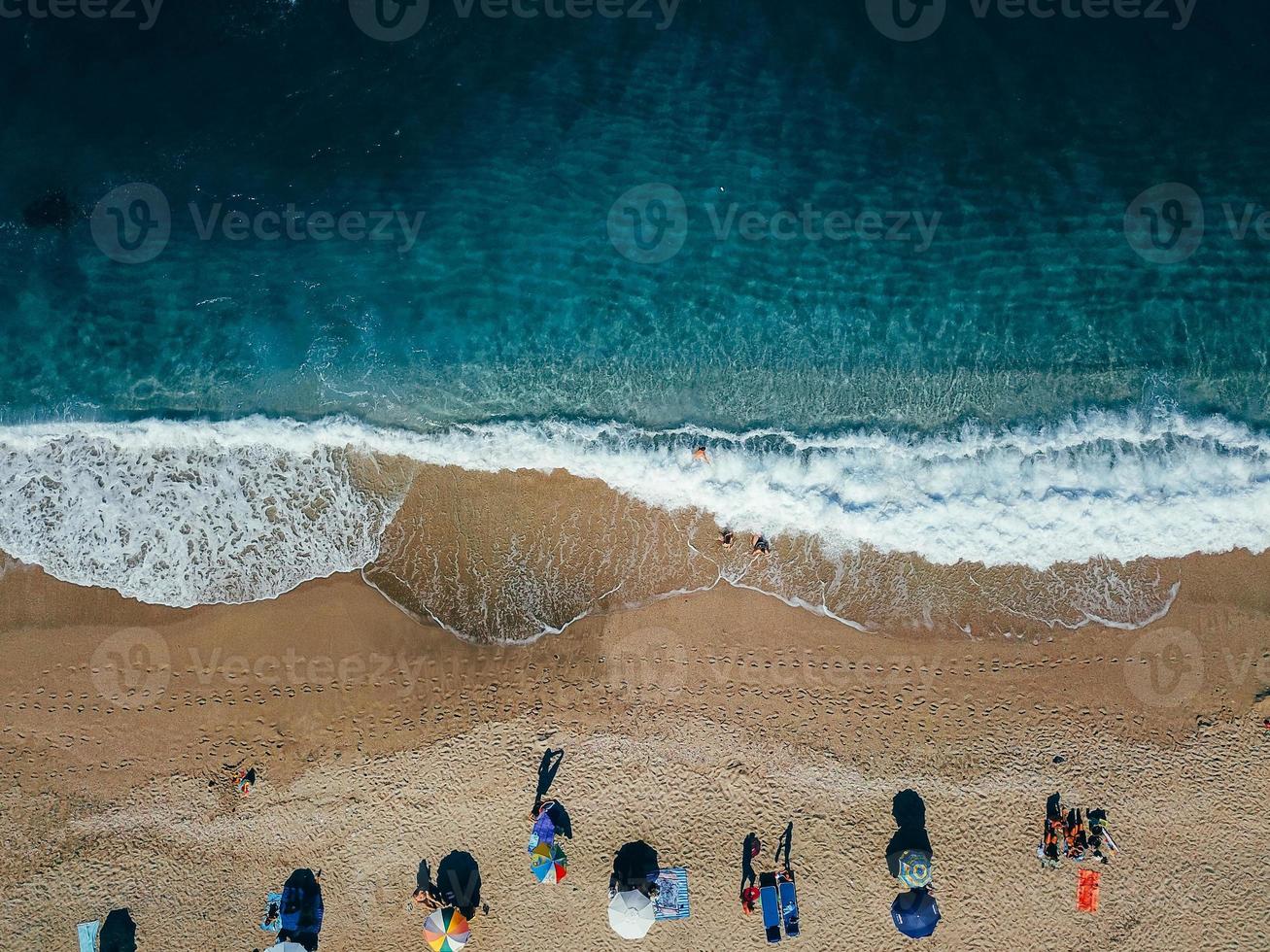 Beach with sun loungers on the coast of the ocean photo