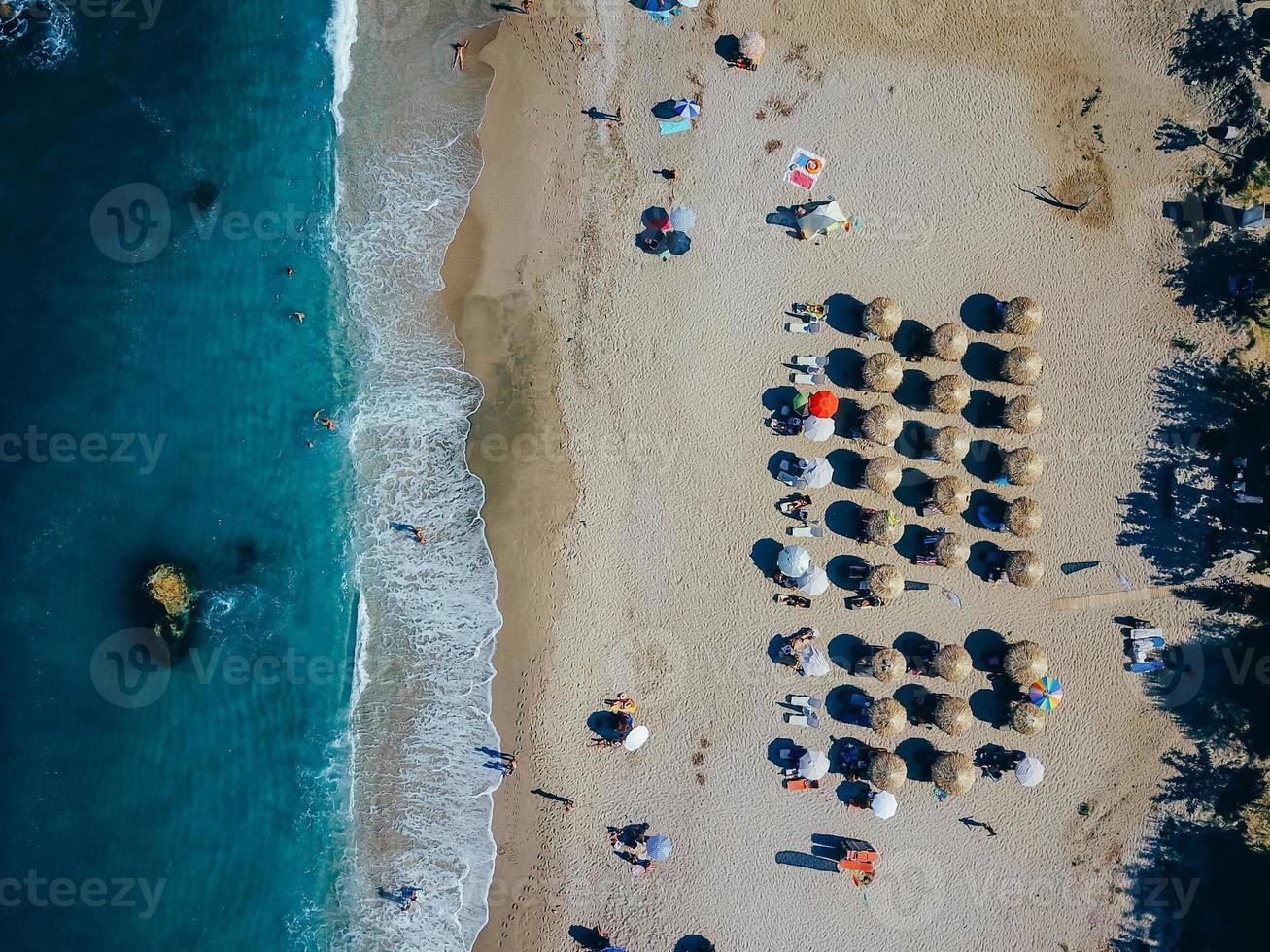 Beach with sun loungers on the coast of the ocean photo