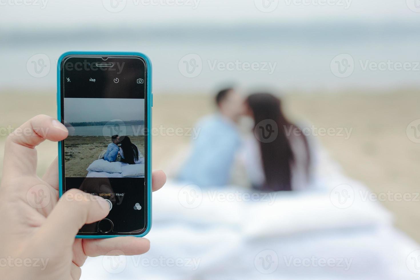 Happy Couple relaxing together on the mattress photo