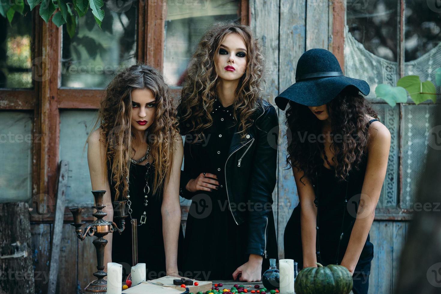 three witches at the table photo