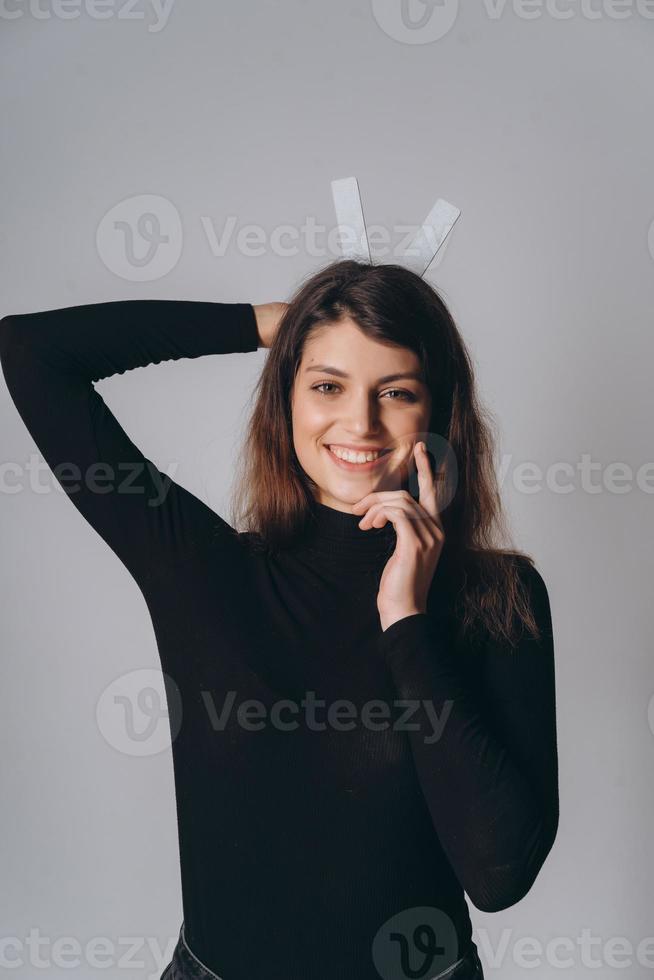 Portrait of a pretty smiling woman posing isolated photo