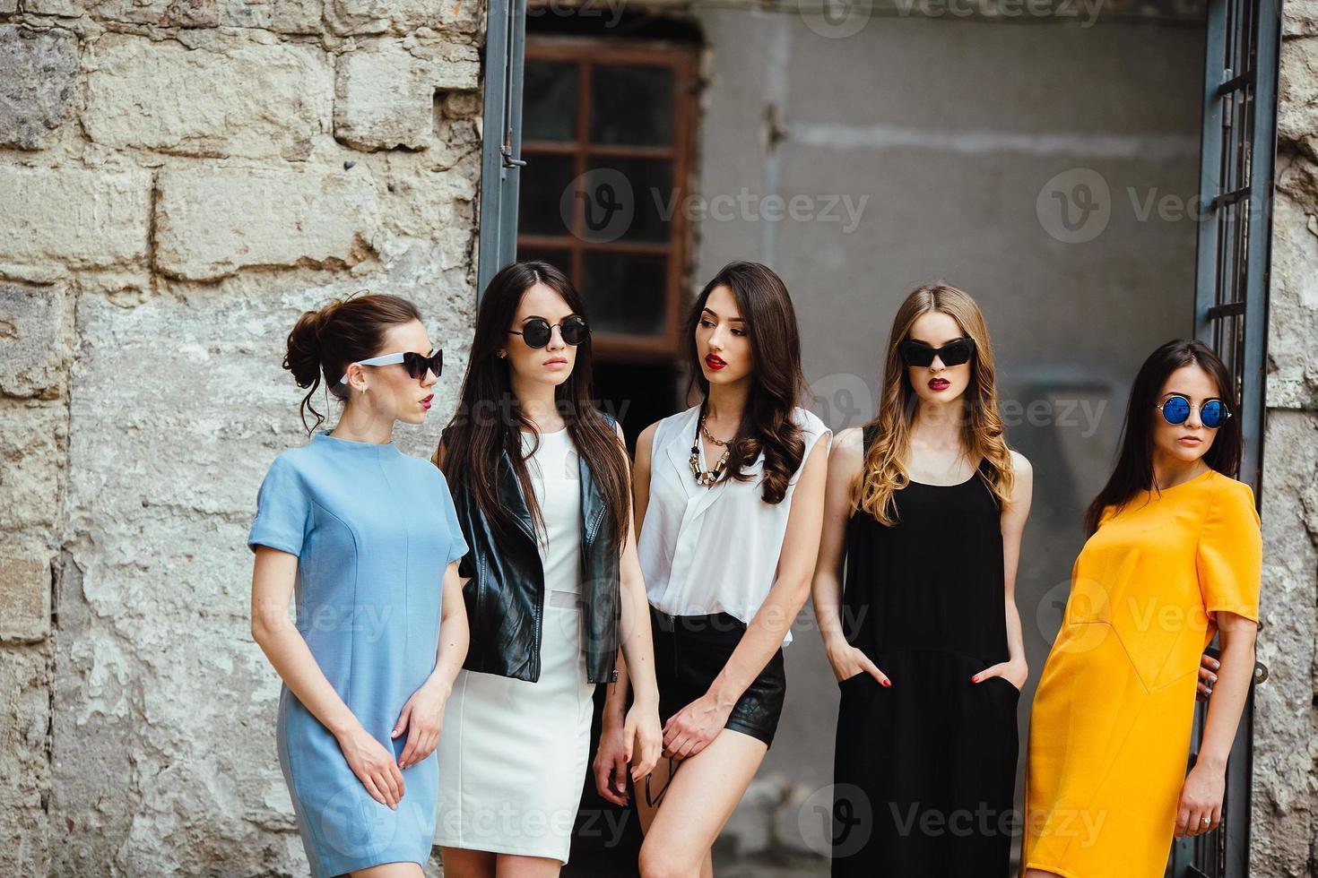 Five young beautiful girls in the city photo