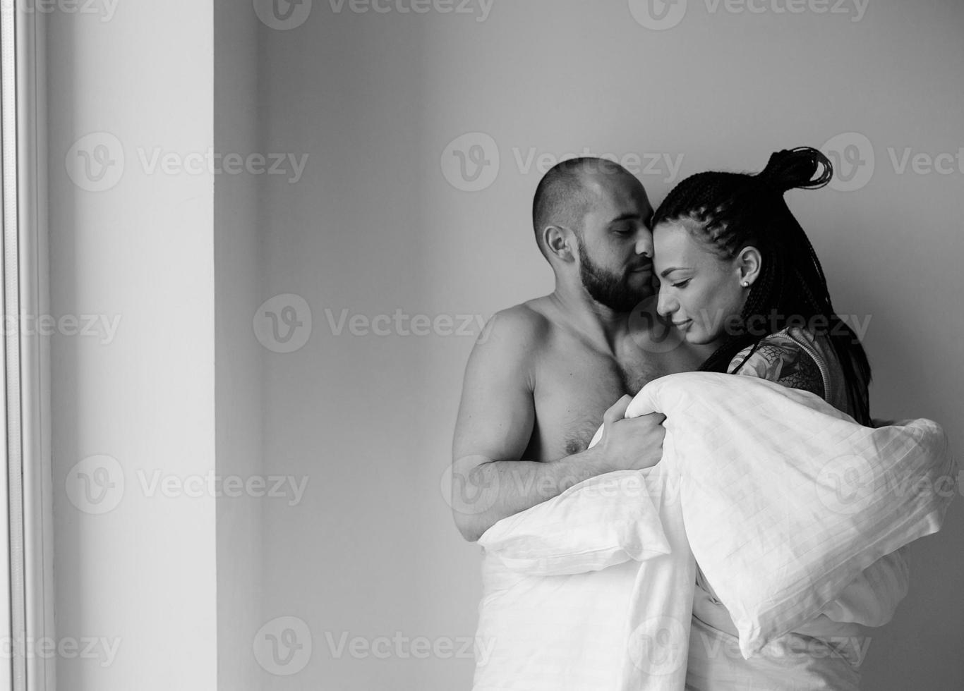 man and woman in the bedroom photo