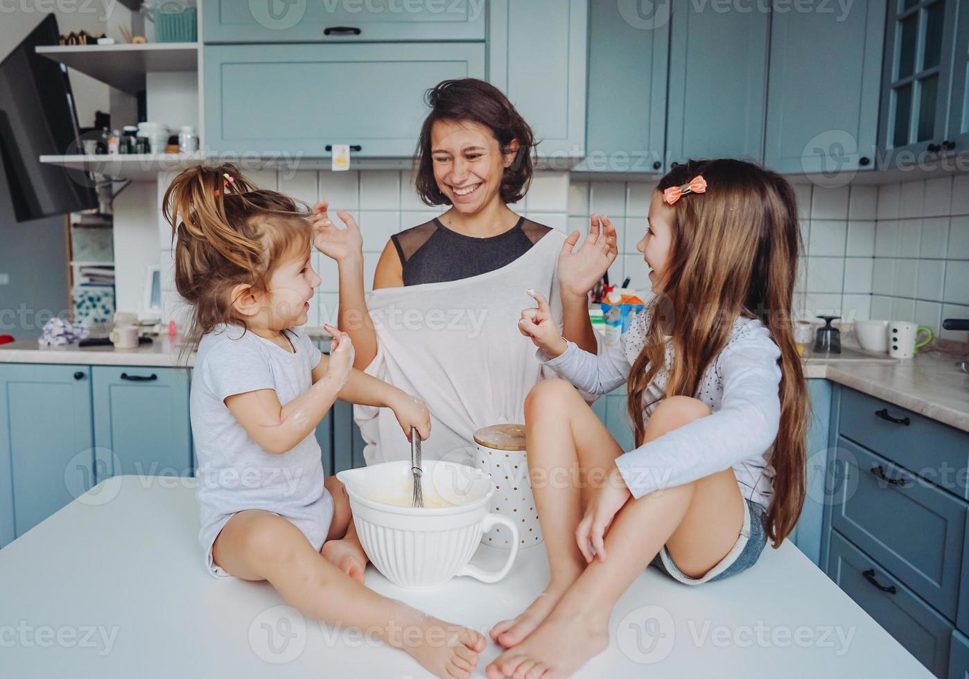 Happy family cook together in the kitchen photo