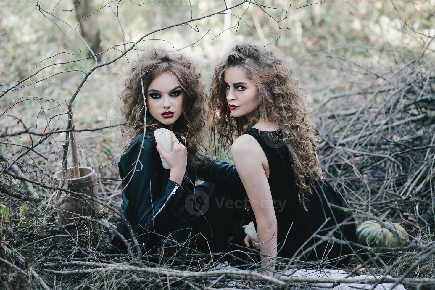 Two vintage witches gathered eve of Halloween photo