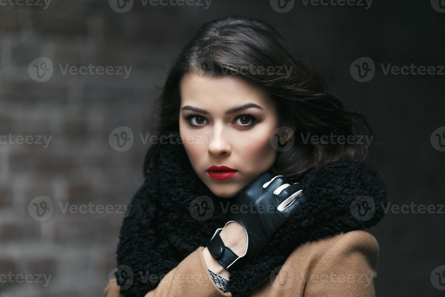 Charming fashion female modell in a coat. photo