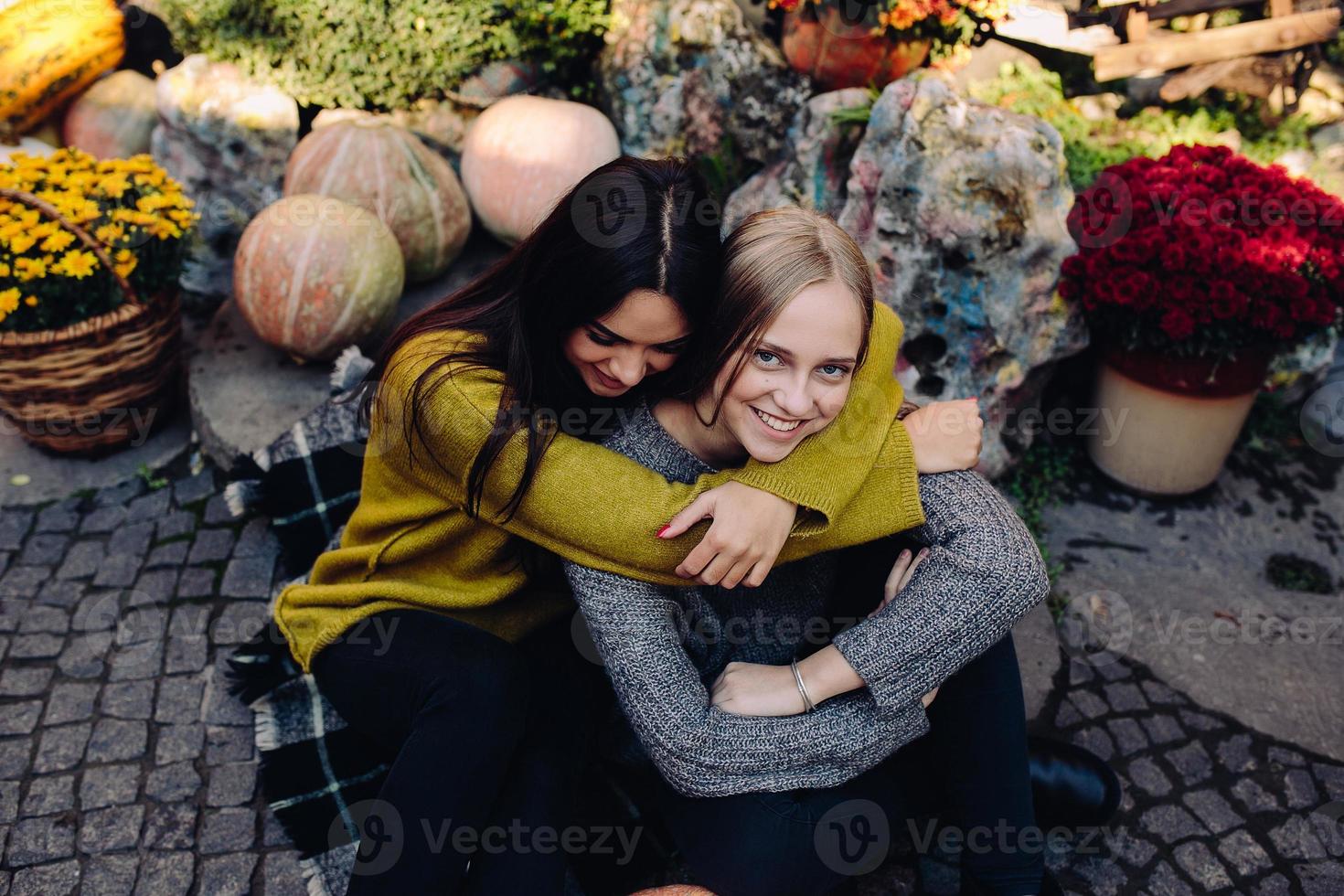 Fashion girls posing on the street photo