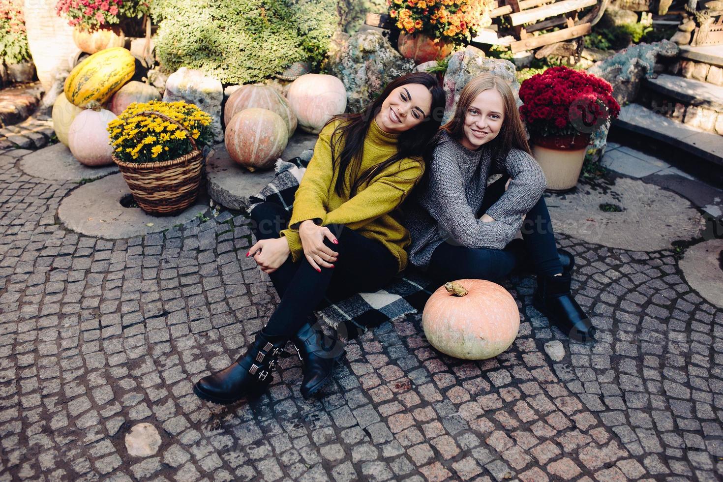 Fashion girls posing on the street photo