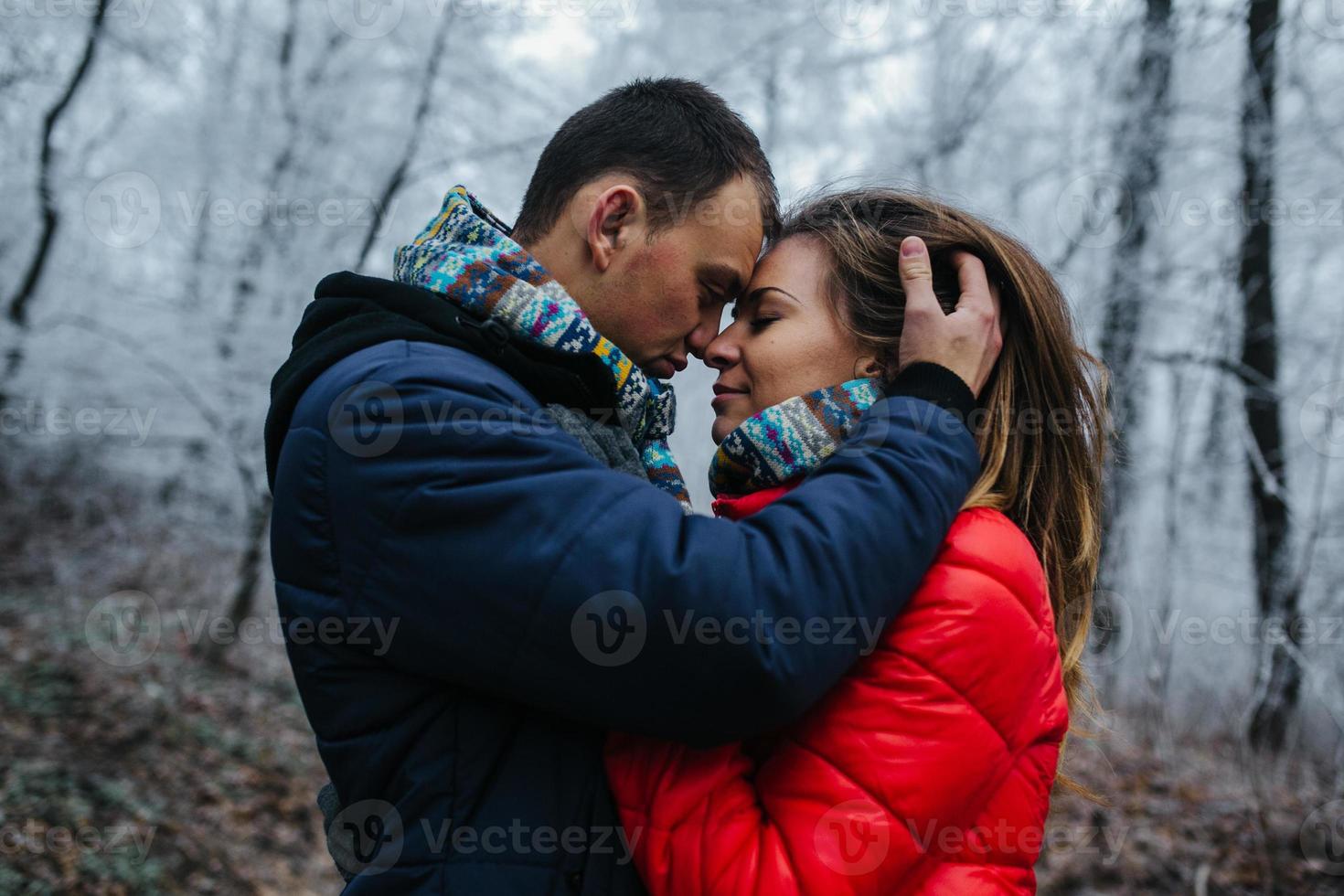 couple walking on a winter park photo