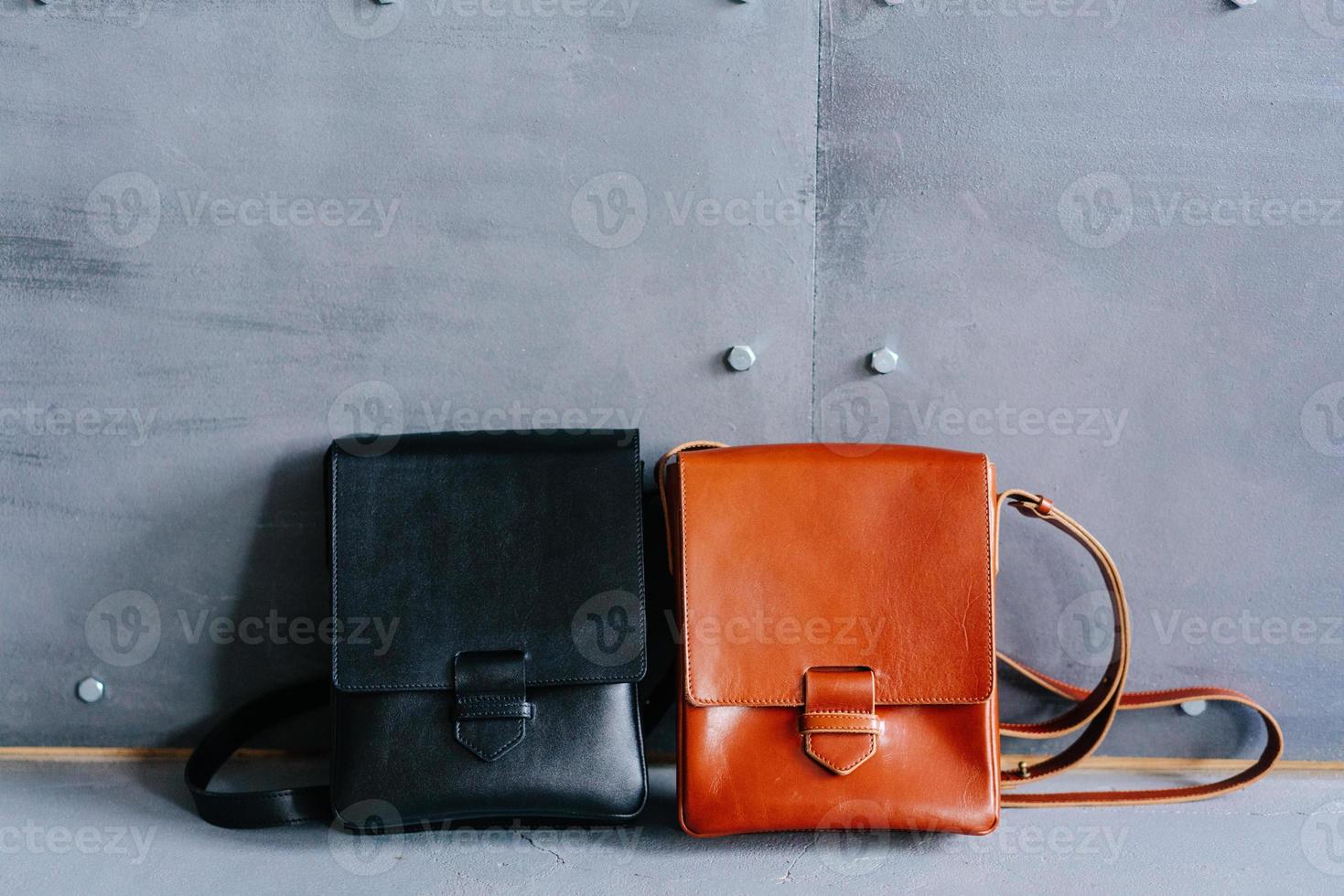 two leather bags on a gray background photo