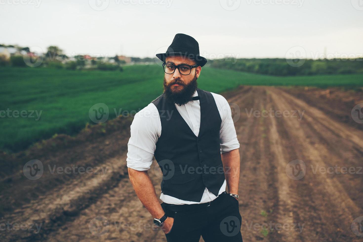 man with beard on the field photo