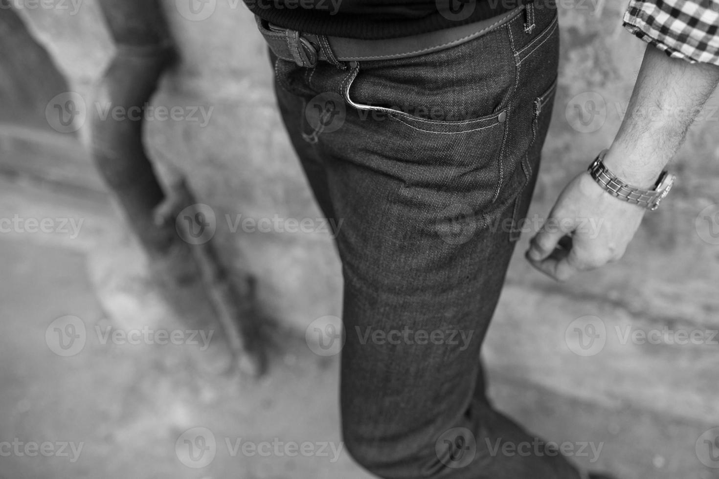 A man dressed in jeans, a close-up shot photo